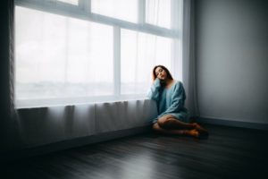 Young women thinking about her new life changes after being diagnosed with HS.